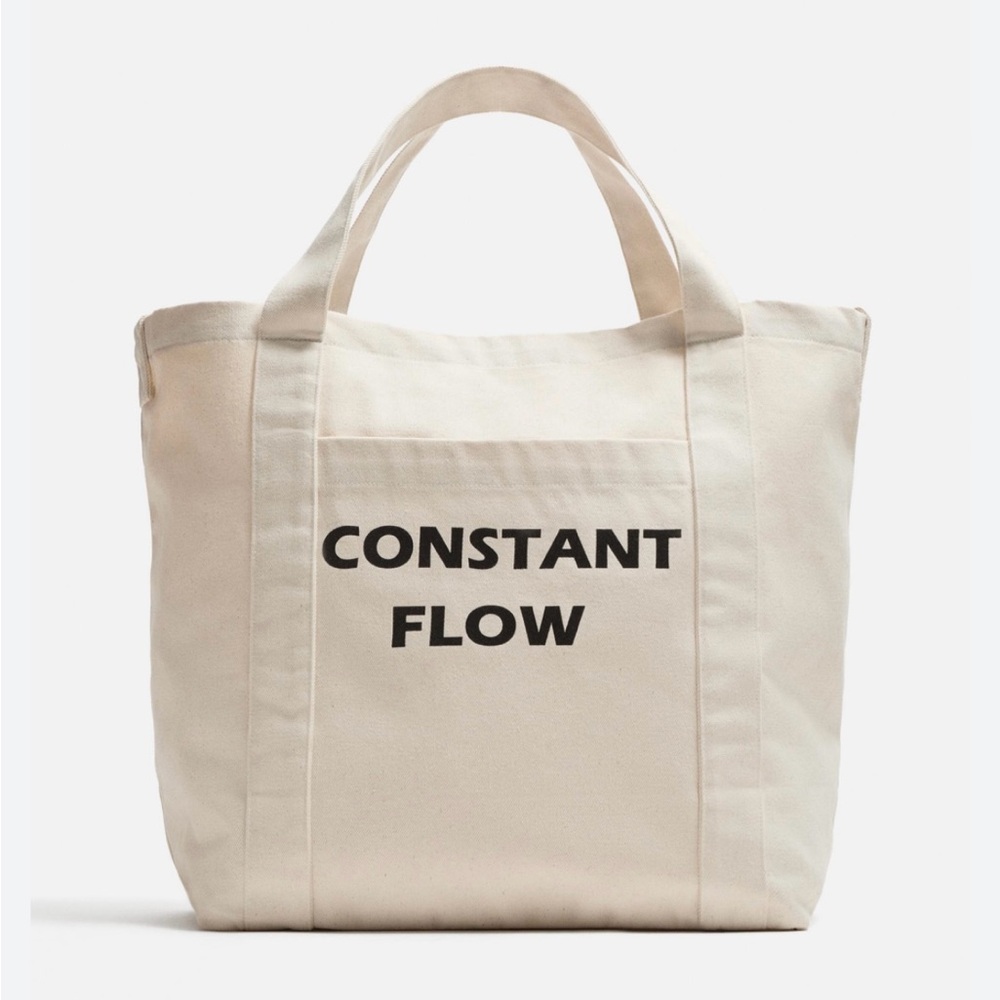 Zara’s Beige Tote Bag with Black Text